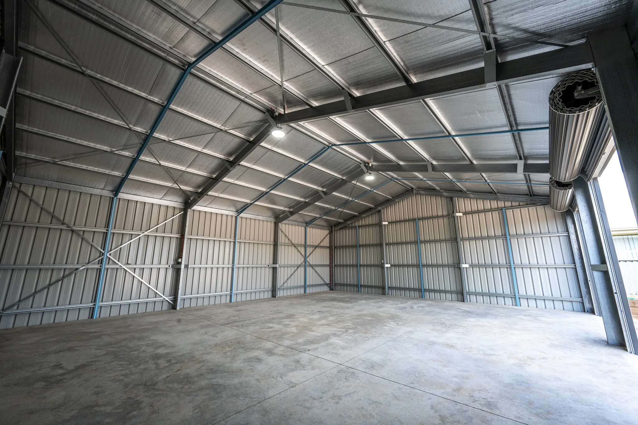 Large agricultural shed wired and ready for power.